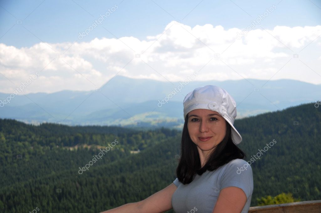 Portrait of girl on a background of mountains