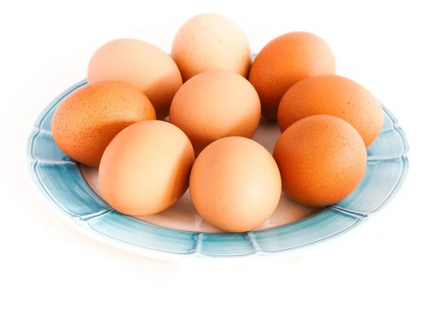 Prato com ovos sobre fundo branco — Fotografia de Stock