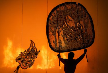 RATCHBURI, THAILAND - APRIL 13: Large Shadow Play is performed a clipart