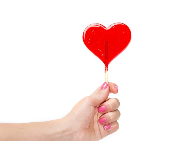 Lollipop in hand — Stock Photo, Image