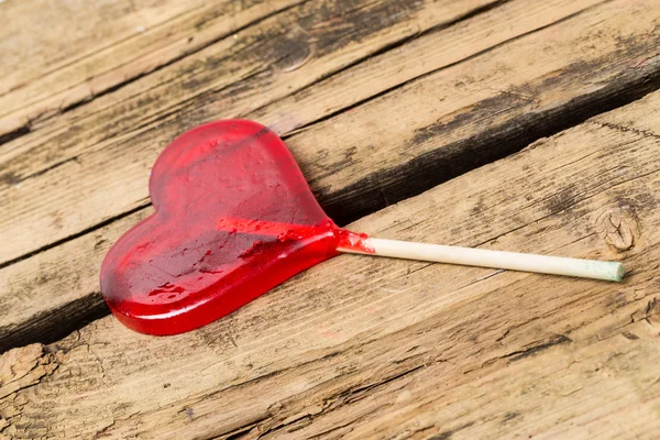 Lollipop on wooden background — Stock Photo, Image