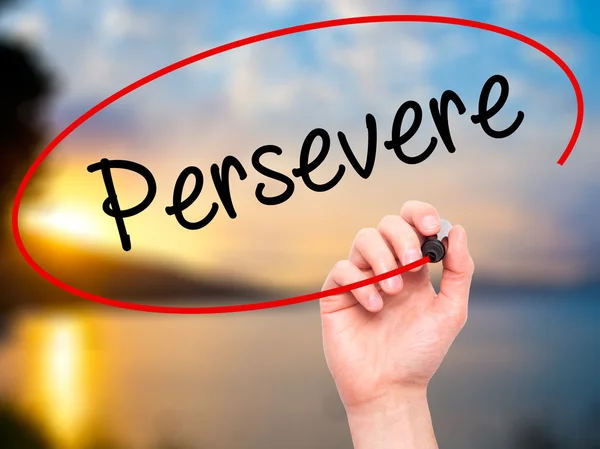 Man Hand writing Persevere with black marker on visual screen. — Stock Photo, Image