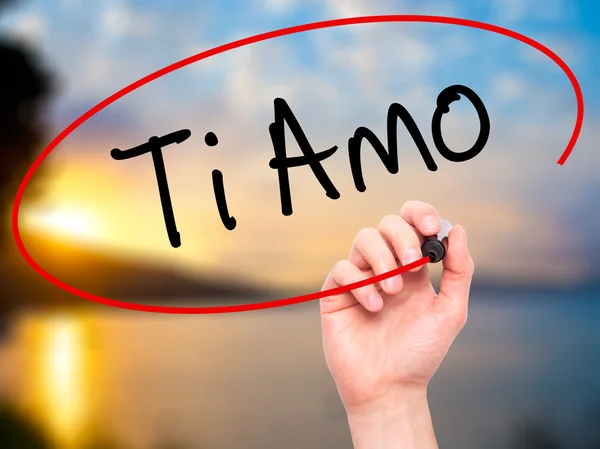 Man Hand writing Ti Amo (I Love You In Italian) with black marke