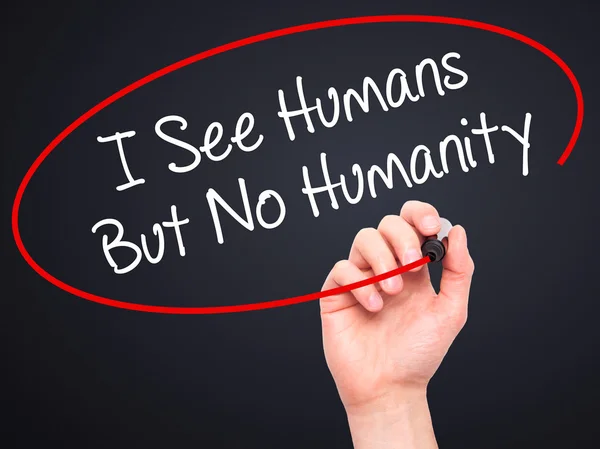Man Hand menulis I See Humans But No Humanity with black marker — Stok Foto