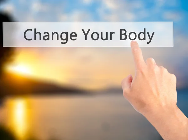 Change Your Body - Hand pressing a button on blurred background — Stock Photo, Image