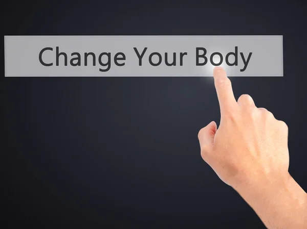 Cambiar su cuerpo - Mano presionando un botón sobre fondo borroso —  Fotos de Stock