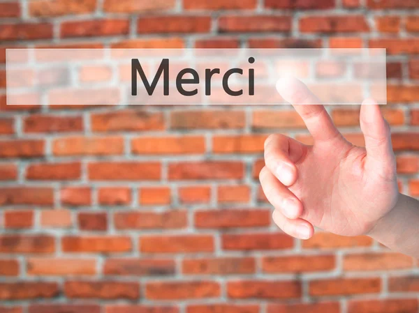 Merci - рука, натиснувши кнопку на концепції розмитість фону — стокове фото