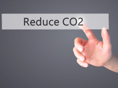 CO2 - arka plan bulanık concep üzerinde bir düğmeye basarak el azaltmak