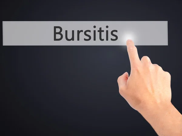 Bursitis - Mano presionando un botón sobre el concepto de fondo borroso — Foto de Stock