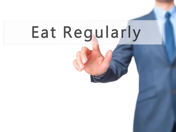 Mangiare regolarmente - Businessman mano premendo il pulsante sul touch screen — Foto Stock