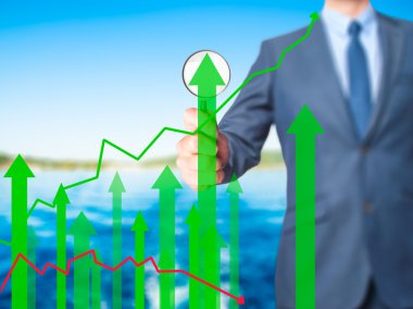 Satış büyüme grafik - sc üzerinde büyüteç tutarak iş adamı