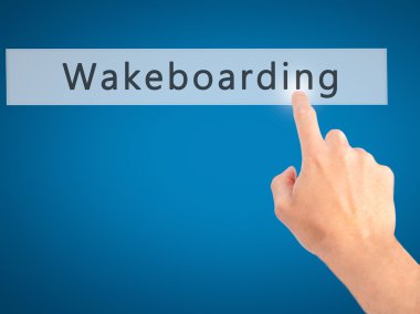 Wakeboarding - arka plan bulanık konsantrasyon üzerinde bir düğmeye basarak el