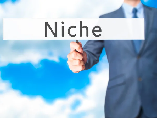 Niche - üzletember kezében jele — Stock Fotó