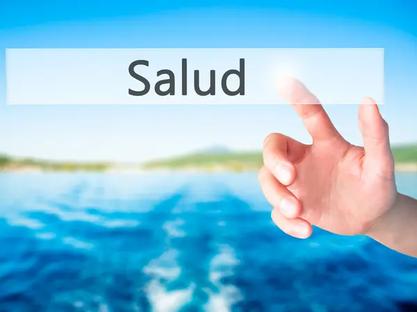 Salud - рука, натиснувши кнопку на концепції розмитість фону — стокове фото