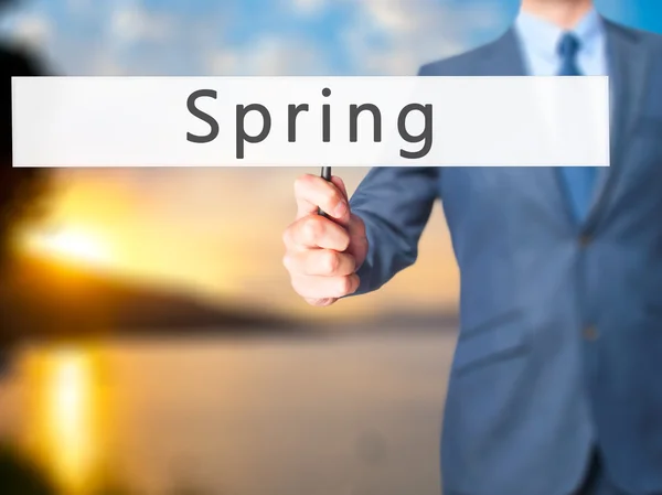 Tavasz - üzletember kezében jele — Stock Fotó