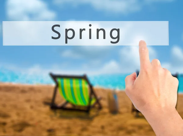 Spring - Hand pressing a button on blurred background concept on — Stock Photo, Image