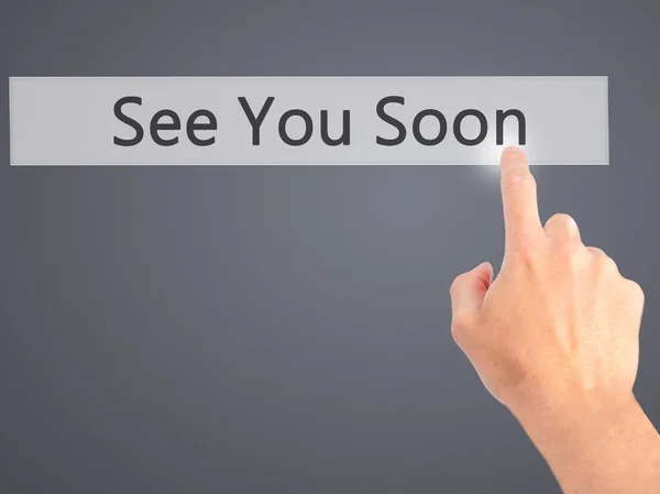 See You Soon - Hand pressing a button on blurred background conc — Stock Photo, Image