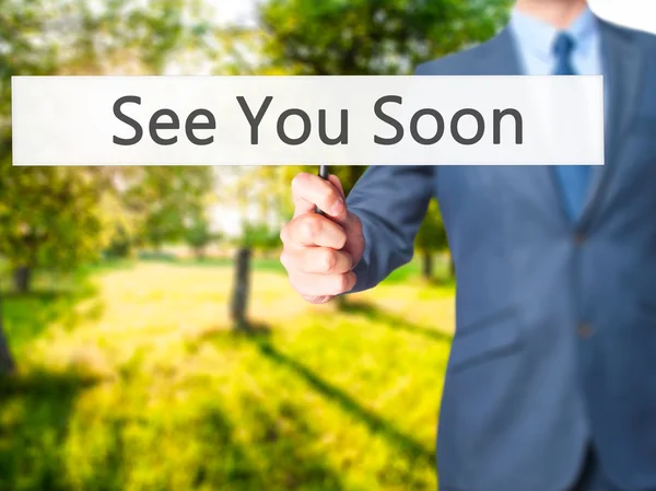 See You Soon - Businessman hand holding sign — Stock Photo, Image