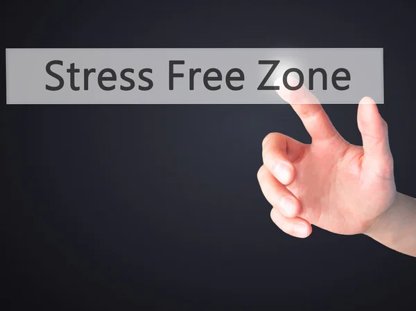 Zona senza stress - Premere a mano un pulsante su sfondo sfocato — Foto Stock