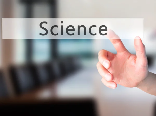 Science - Hand pressing a button on blurred background concept o — Stock Photo, Image