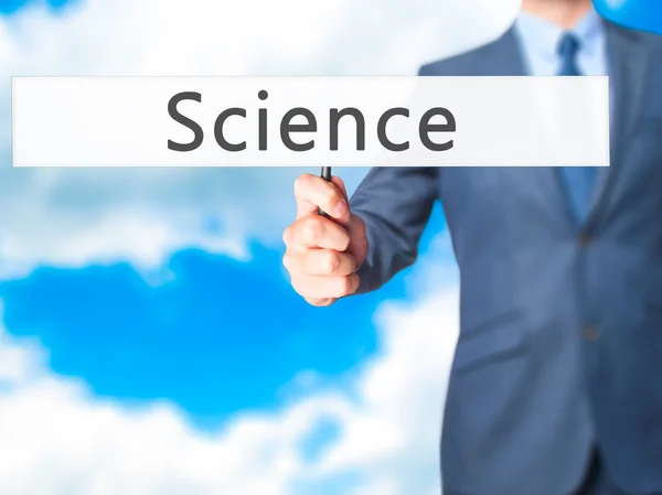 Science-affärsman hand innehav Sign — Stockfoto