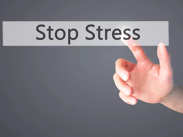 Stop Stress - Mano presionando un botón sobre el cono de fondo borroso —  Fotos de Stock