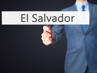 El Salvador - işadamı el işareti tutarak