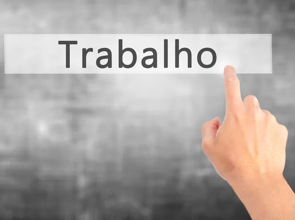 Trabalho (praca w języku portugalskim) - ręcznie, naciskając przycisk na blurre — Zdjęcie stockowe