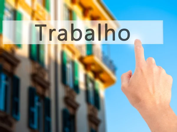 Trabalho (praca w języku portugalskim) - ręcznie, naciskając przycisk na blurre — Zdjęcie stockowe