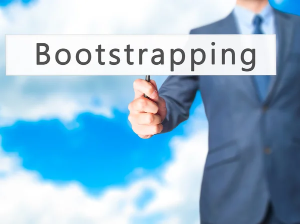 Uitvoeren van de bootstrap - zakenman hand hebt van teken — Stockfoto