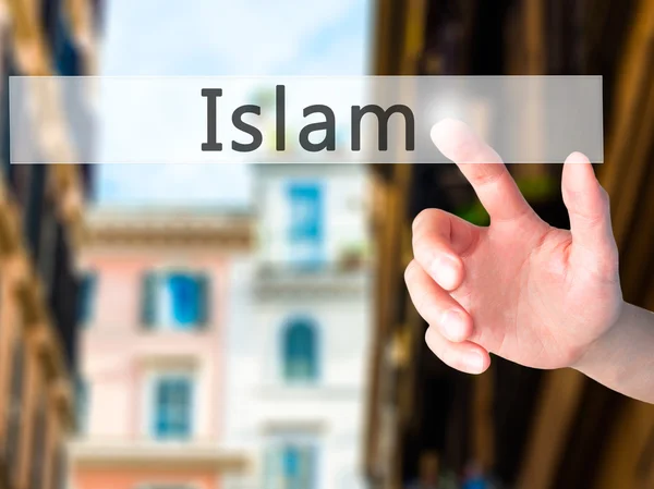 Islam - Hand trycka på en knapp på suddig bakgrund koncept — Stockfoto