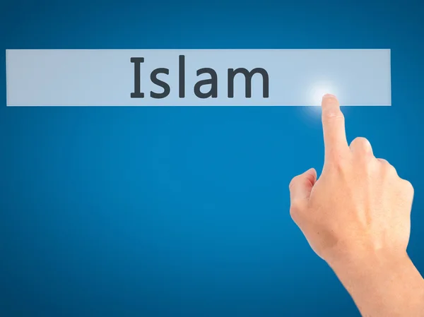Iszlám - kéz egy elmosódott háttér koncepció gomb lenyomásával — Stock Fotó