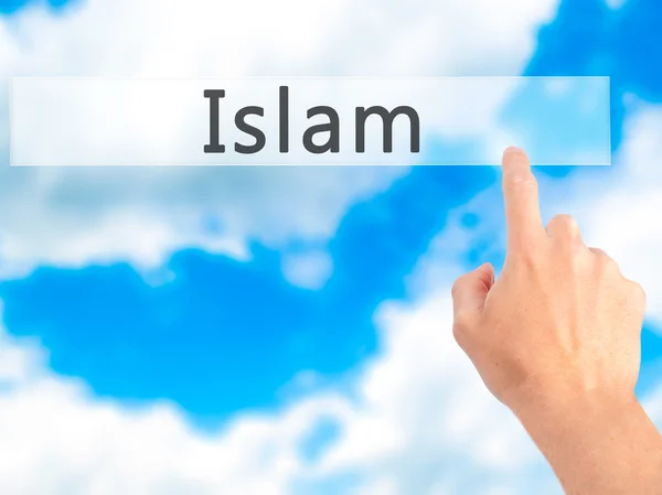 Islam - Hand pressing a button on blurred background concept on — Stock Photo, Image