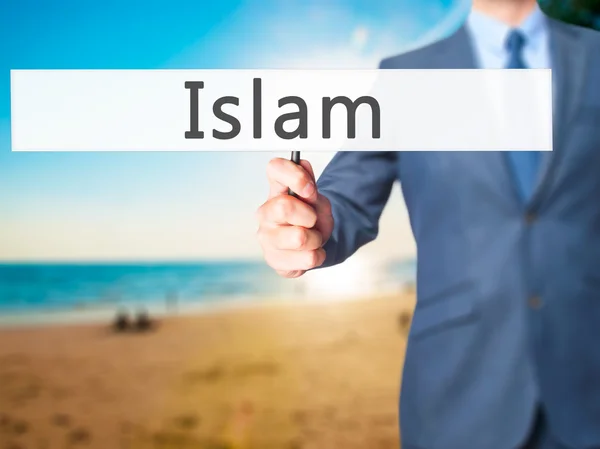 Islam - biznesmen ręka trzyma znak — Zdjęcie stockowe