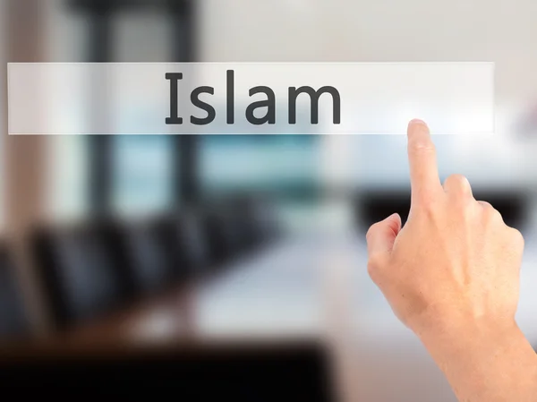 Islam - Hand trycka på en knapp på suddig bakgrund koncept — Stockfoto