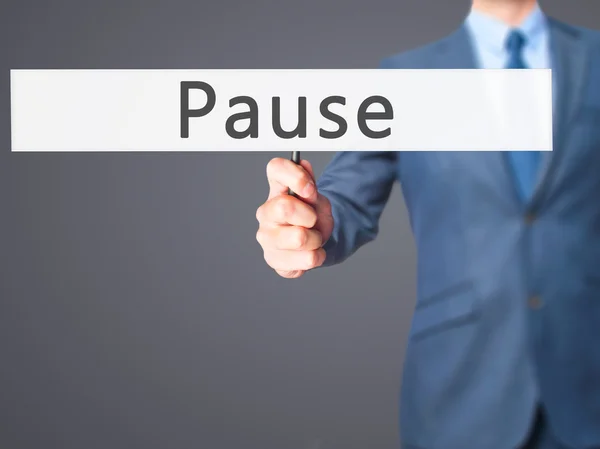 Pause - Businessman hand holding sign — Stock Photo, Image