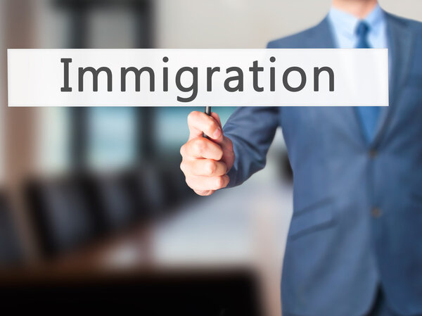 Intellectual Property - Businesswoman hand pressing button on to