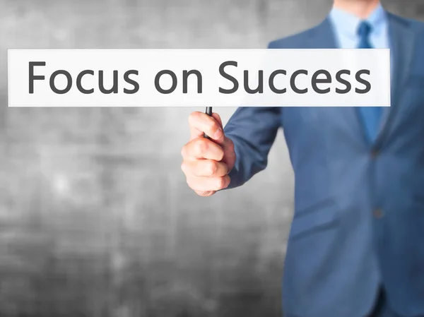 Focus on Success  - Businessman hand holding sign — Stock Photo, Image