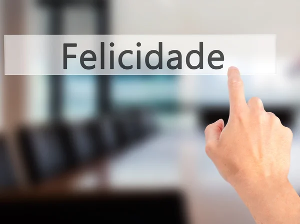 Felicidade (щастя на португальській мові) - рукою, натисненням кнопки — стокове фото