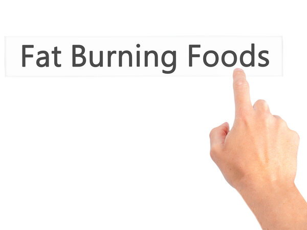 Fat Burning Foods - Hand pressing a button on blurred background