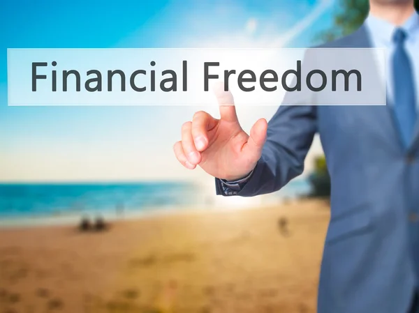 Financial Freedom - Businessman hand pressing button on touch sc — Stock Photo, Image