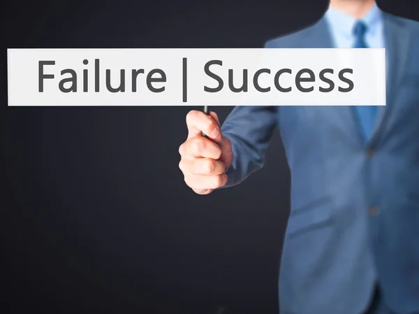 Failure Success - Businessman hand holding sign — Stock Photo, Image