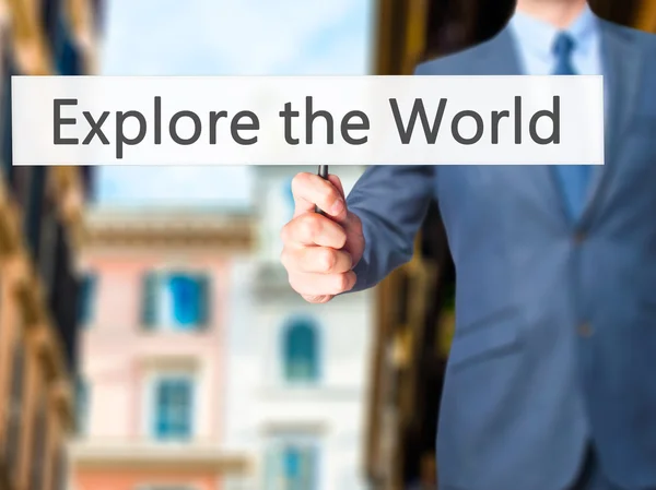 Explore the World - Businessman hand holding sign — Stock Photo, Image