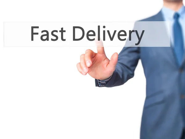 Fast Delivery - Businessman hand pressing button on touch screen — Stock Photo, Image