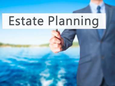 Emlak Planlama - işadamı el işareti tutarak