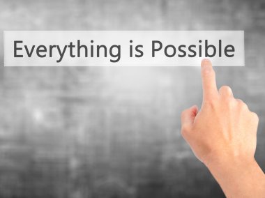 Her şey mümkündür - bulanık backg üzerinde bir düğmeye basarak el