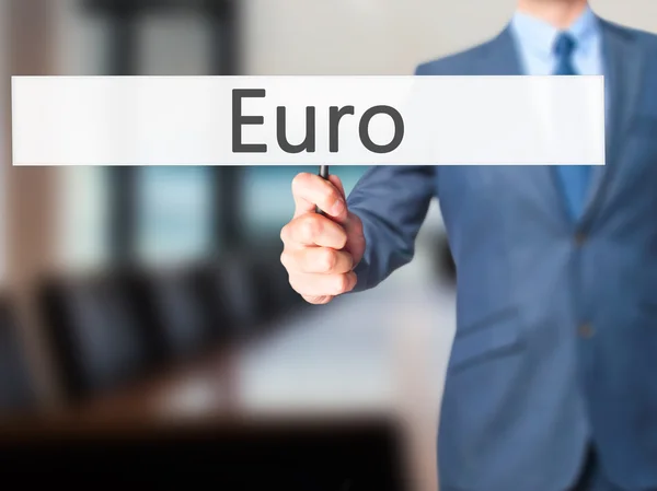 Euro - Empresario mano sosteniendo cartel —  Fotos de Stock