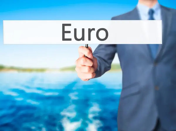 Euro - Empresario mano sosteniendo cartel — Foto de Stock