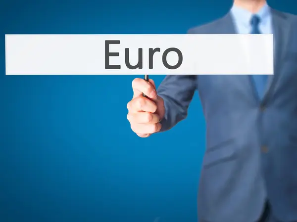 Euro - Empresario mano sosteniendo cartel —  Fotos de Stock