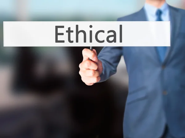 Ethical - zakenman hand hebt van teken — Stockfoto